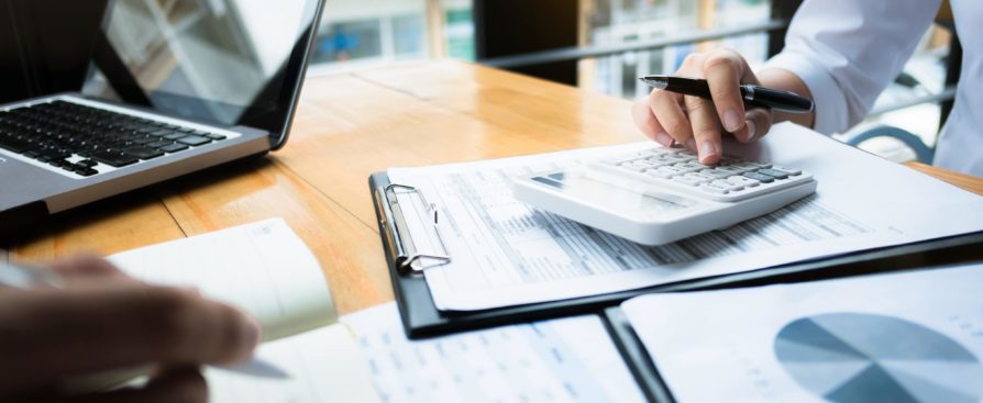 business audits using a calculator financial data investment fund at a workplace, wealth concept Trasury